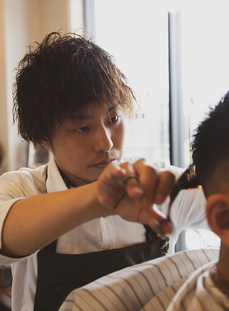 明比 拓也
